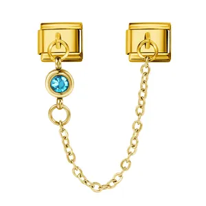 Gold Italian modular charm bracelet link with blue birthstone crystal and safety chain