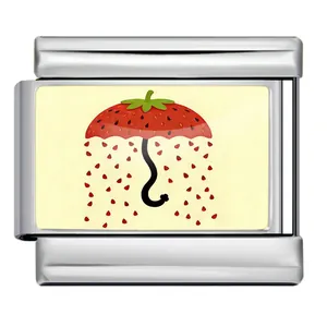 Detailed view of Italian modular stainless charm with strawberry umbrella pattern
