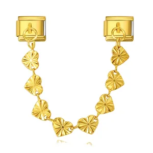 Close-up of gold Italian charm safety chain with double hooks and radiant heart pendants