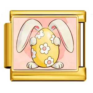 Detailed macro view of a gold Italian charm featuring an Easter bunny with a floral egg.
