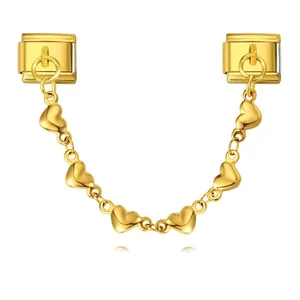 Close-up detail of a golden heart charm chain for Italian modular bracelets