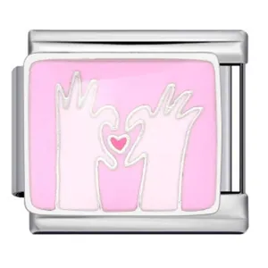 Close-up detail of Italian modular bracelet charm with pink enamel hands heart pattern