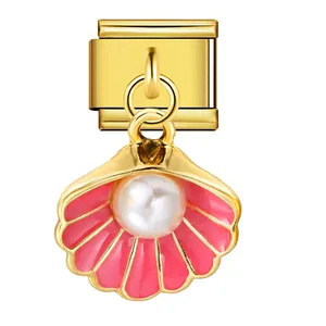 Detailed view of a gold Italian charm link with a pink enamel shell and white pearl