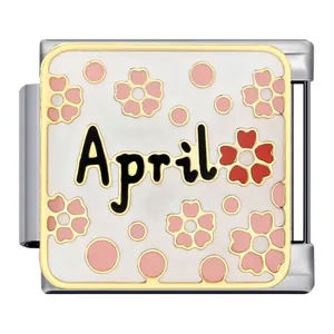 Detailed view of Italian charm link with 'April' text and pink sakura flowers