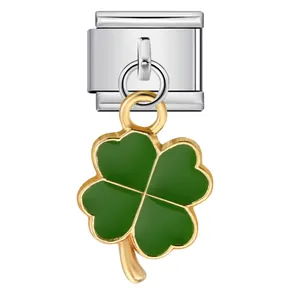 Detail of a green four-leaf clover charm on a silver Italian modular bracelet link