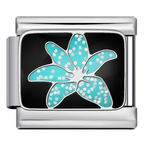 Close-up detail of Italian charm bracelet link with a blue glitter lily flower design