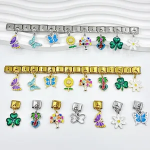 Charms a farfalla in smalto colorato su bracciali modulari italiani oro e argento.