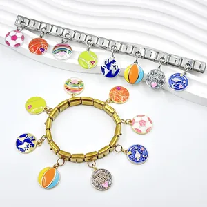 Detail of gold and silver Italian modular bracelets with colorful sports and heart charms.