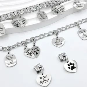 Detail of stainless steel Italian charm bracelets with engraved family heart pendants.