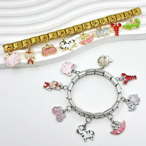 Detailed view of DIY Italian modular charm bracelets with cute animal enamel pendants.