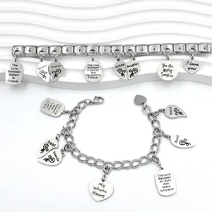 Close-up of stainless steel Italian modular and chain bracelets with engraved charms