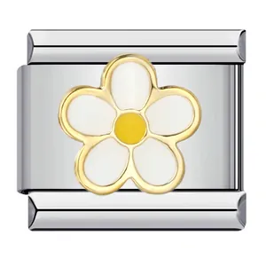 Macro detail of Italian charm bracelet link with white and yellow flower pattern.