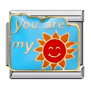 Close-up of Italian modular charm link with smiling sun design and text You are my