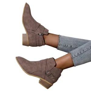 Pointed-toe Chelsea ankle boots with buckle strap and side zipper in taupe color
