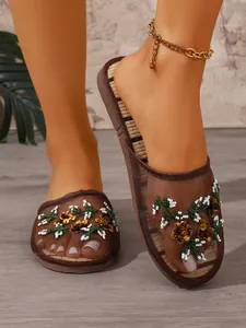 Elegant mesh mules with floral embroidery and sequins for a stylish indoor look