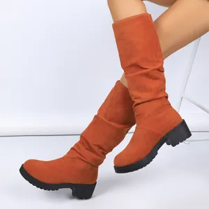 Stylish orange slouchy mid-calf boots with low block heel and non-slip sole for women.
