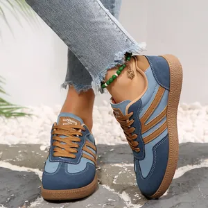 Stylish retro color-block trainer sneakers for women with blue and tan fabric design