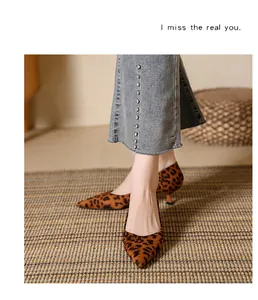 Elegant leopard print pointed toe kitten heel pumps with comfortable mid-heel design.