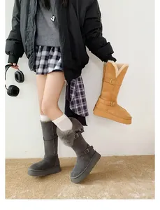Warm women's tall snow boots with thick platform soles and faux fur lining.