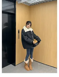 Stylish woman wearing brown platform fur-lined snow boots in a modern indoor setting