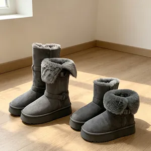 Stylish grey platform snow boots with thick fur lining for women in winter.