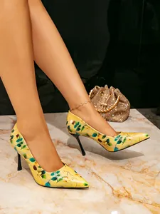 Elegant yellow floral print pointed-toe stiletto pumps for women showcased on model