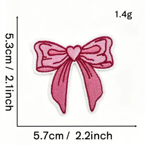 Detail view of pink embroidered bow patch showing precise measurements 5.7x5.3cm