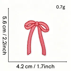 Detailed view of pink bow embroidery patch showing dimensions 5.6x4.2cm and 0.7g