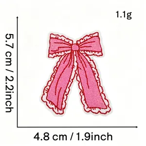 Detailed view of pink bow embroidery patch with dimensions 4.8 x 5.7 cm and 1.1g weight.