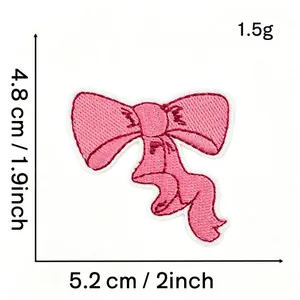 Close-up view of a pink bow embroidered patch showing size 5.2x4.8 cm and weight 1.5g