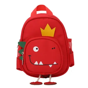 Mochila infantil de dinosaurio rojo para jardín de infancia con detalle corona