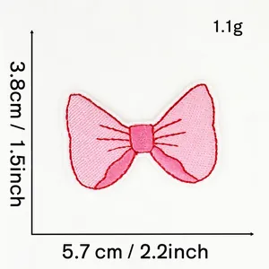 Detailed view of pink bow embroidered patch with 5.7x3.8cm measurement for DIY craft