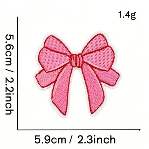 Detailed view of pink bow embroidered patch showing 5.6cm height and 5.9cm width dimensions