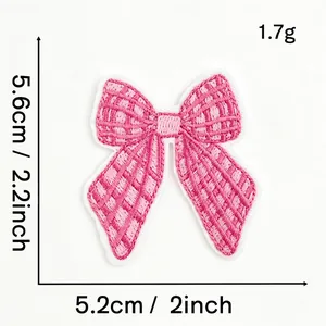 Detailed dimensions of pink embroidered bow patch for DIY clothing accessories.