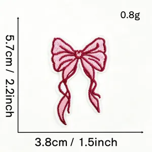 Detailed specification of the pink bow embroidered patch showing dimensions 5.7cm by 3.8cm