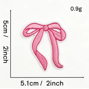 Detail view of a pink bow embroidered patch showing precise dimensions of 5.1cm x 5cm
