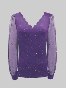 Macro view of scalloped V-neckline and starry mesh sleeve details on purple top