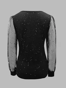 Elegant black long sleeve top with sheer mesh star print sleeves, detailed back view
