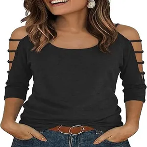 Close-up of women's black cold-shoulder T-shirt with cutout sleeve details