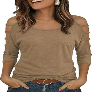 Detailed view of the cold-shoulder sleeve with ladder strap design on this khaki T-shirt