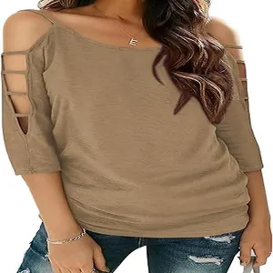 Macro detail of khaki cold shoulder T-shirt featuring stylish hollow-out sleeve straps