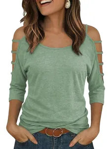 Front view of sage green t-shirt with off-shoulder cutouts and multi-strap sleeves