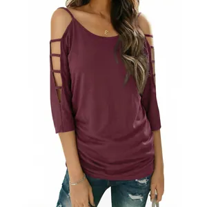 Detailed view of burgundy off-shoulder top featuring stylish ladder cut-out half sleeves.