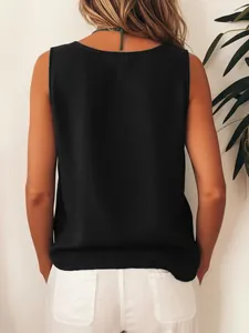 Back view of women's black sleeveless loose vest casual top with white pants