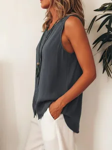 Close-up side view of women's loose dark gray sleeveless shirt with single-breasted buttons