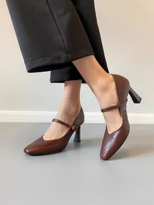 Vintage brown leather Mary Jane high heels with strap and chunky heel detail view