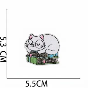 Premium embroidered cartoon cat patch on books, detailed 5.5x5.3cm dimension view