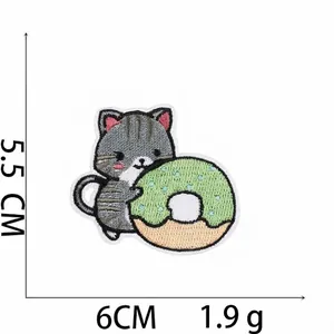 Detailed view of a cartoon cat embroidery patch with size and weight measurements.
