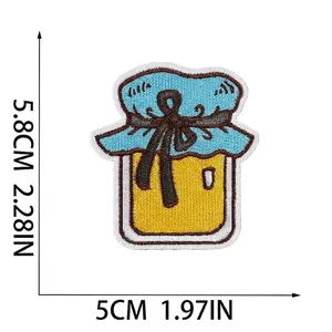 Detailed view of cartoon honey jar embroidery patch showing dimensions in cm and inches
