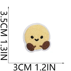Detailed view of cute yellow round embroidered smile patch with dimensions 3.5x3cm